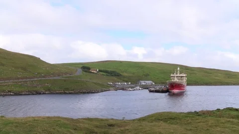 Pelagic trawler moored at Collafirth pier in the north of Shetland Stock Footage 77569874
