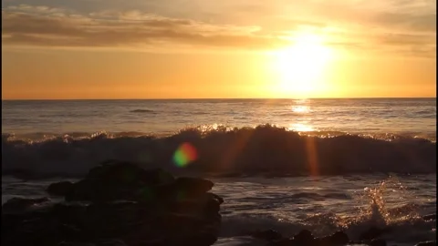 A pelican dives into the water at sunset Stock Footage 332953849