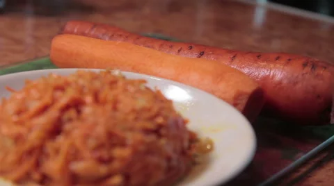Pelled carrot lie on table, side dish Видео 61492972