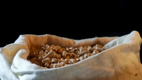 Pellets are poured into a bag, a background Stock Footage 83117389