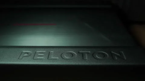 Peloton Treadmill - Embossed brand name while running - Pan Lighting Stock Footage 229953489