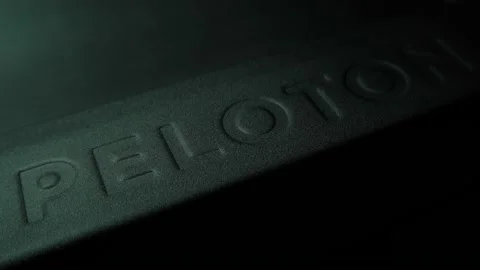 Peloton Treadmill - Embossed brand name while running - Pan Lighting Stock Footage 229955717