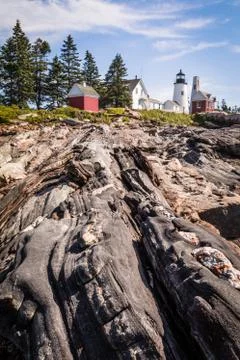 Pemaquid Point Lighthouse atop dramatic rocky coast in Bristol, Maine Stock Photos