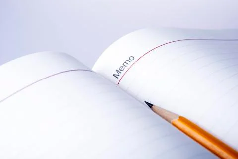 Pen above notebook Stock Photos