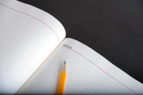 Pen above notes Stock Photos