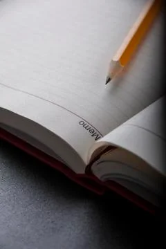 Pen above notes Stock Photos