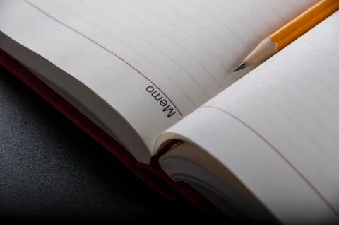 Pen above notes Stock Photos