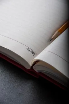 Pen above notes Stock Photos