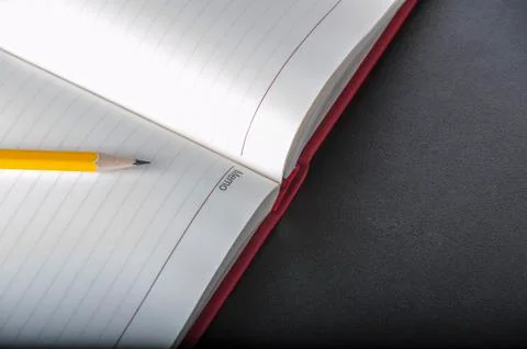 Pen above notes Stock Photos