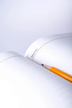 Pen above notes Stock Photos