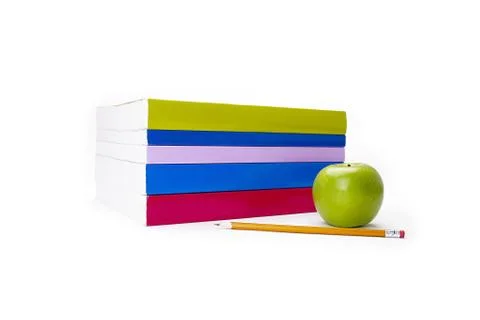 Pen and apple beside a stack of books Foto stock