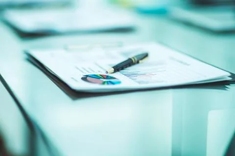 Pen and financial documents on the table of the businessman Stock Photos