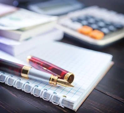 Pen and note Stock Photos