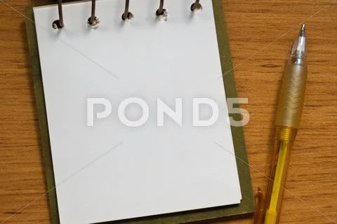 Pen and notebook Stock Photos