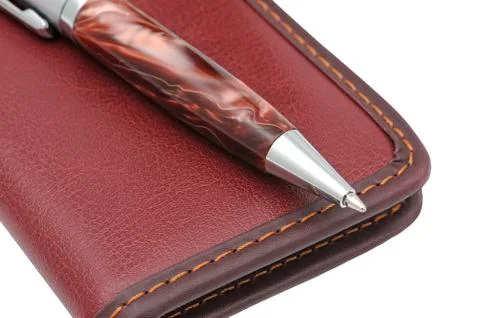 A pen and  notebook Stock Photos