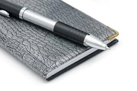 A pen and notebook Stock Photos