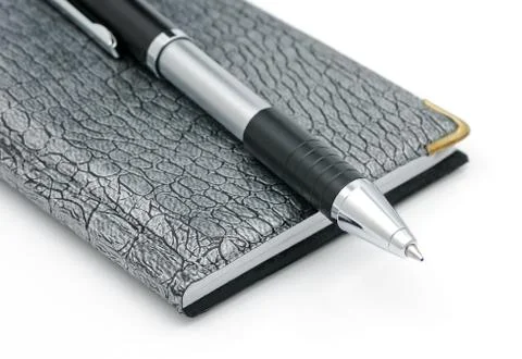 Pen and notebook Stock Photos