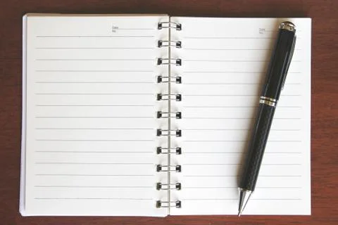 Pen and notebook Stock Photos