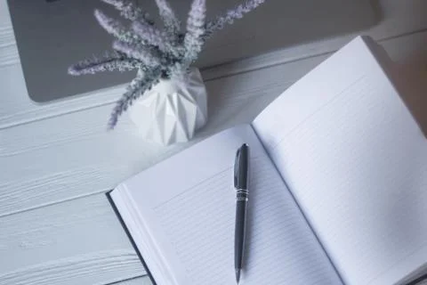 Pen and a notebook at the workplace Stock Photos