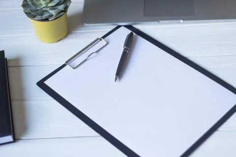 Pen and a notebook at the workplace Stock Photos