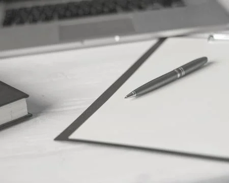 Pen and a notebook at the workplace Stock Photos