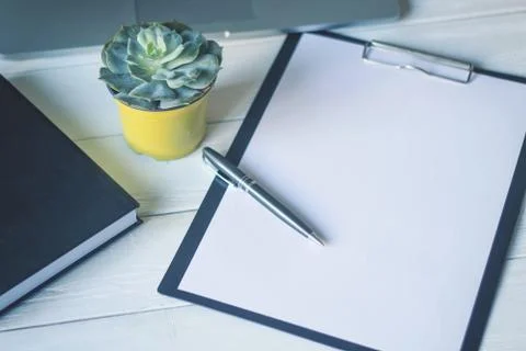 Pen and a notebook at the workplace Stock Photos
