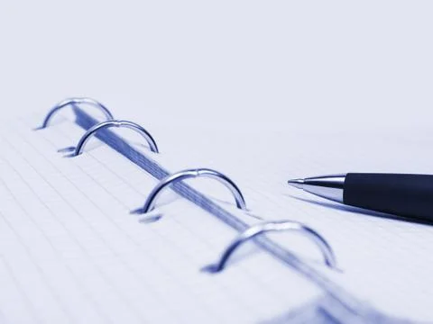 Pen and notepad Stock Photos