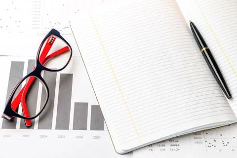 A pen and a notepad Stock Photos