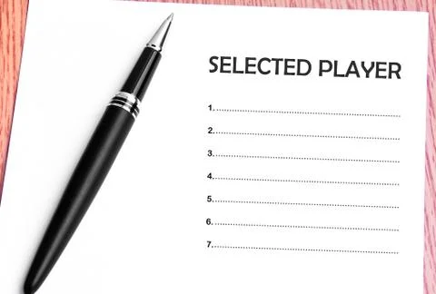 Pen  and notes paper with selected player list Stock Photos