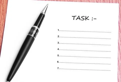 Pen  and notes paper with task list Stock Photos
