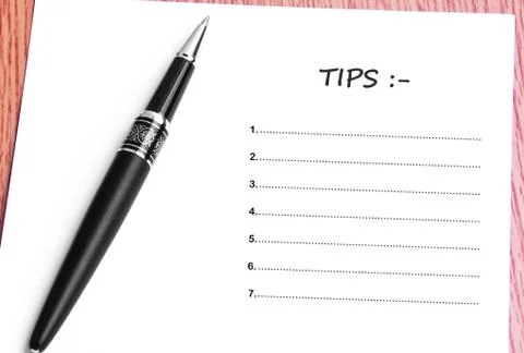 Pen  and notes paper with tips list Stock Photos