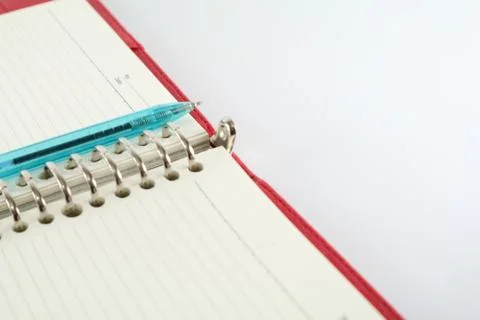 Pen and Open Book Stock Photos