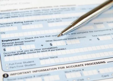 Pen on the Application Form Stock Photos