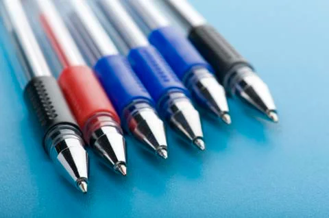 Pen on blue close up Stock Photos