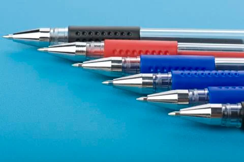 Pen on blue close up Stock Photos