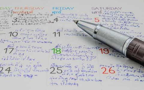 Pen on calendar Stock Photos