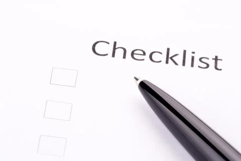 Pen on checklist Stock Photos