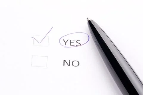Pen on checklist Stock Photos