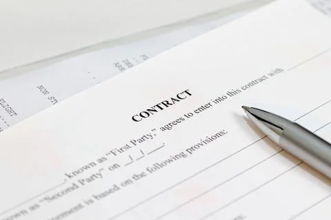 Pen on the contract papers Stock Photos