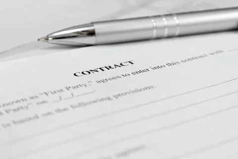 Pen on the contract papers Stock Photos