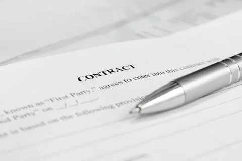 Pen on the contract papers Stock Photos