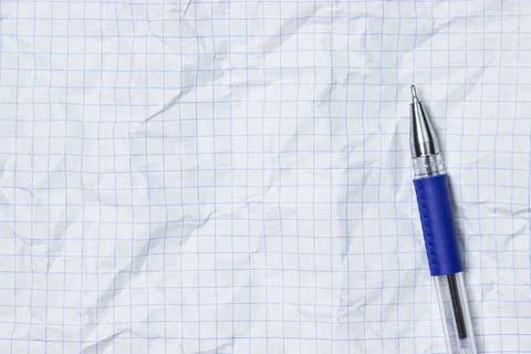 Pen on a crumpled sheet of paper. Stock Photos