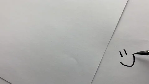 The pen draws a smiley in black ink. Stock Footage 228879335