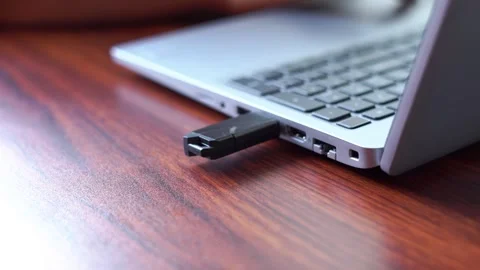 Pen drive connect and remove from the laptop. close up video footage Stock Footage 295306208