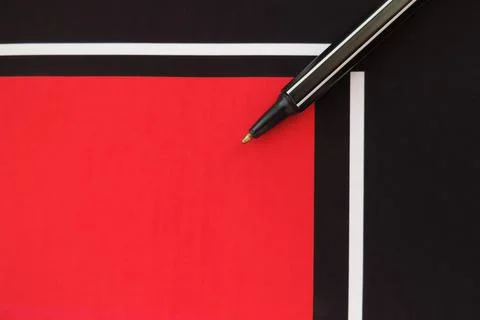 Pen on geometric pattern papers in minimal concept. Stock Photos