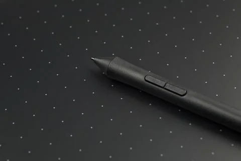 Pen on a graphics tablet, close up. Stock Photos