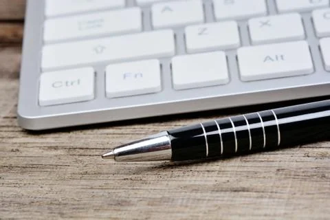 Pen with keyboard computer on table Stock Photos