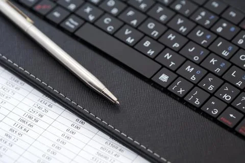 Pen On Laptop Stock Photos