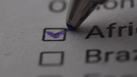 Pen mark a Checkbox labeled 'African American' on a document. Stock Footage 263077065