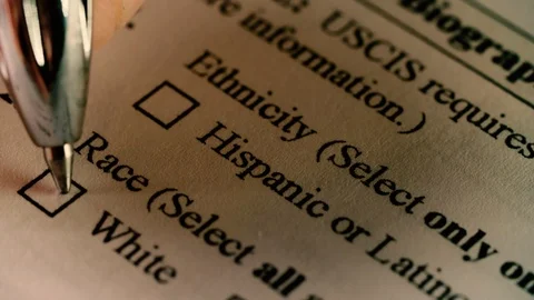 A pen marks a checkbox labeled white for ethnicity on a US immigration form Stock Footage 92820487